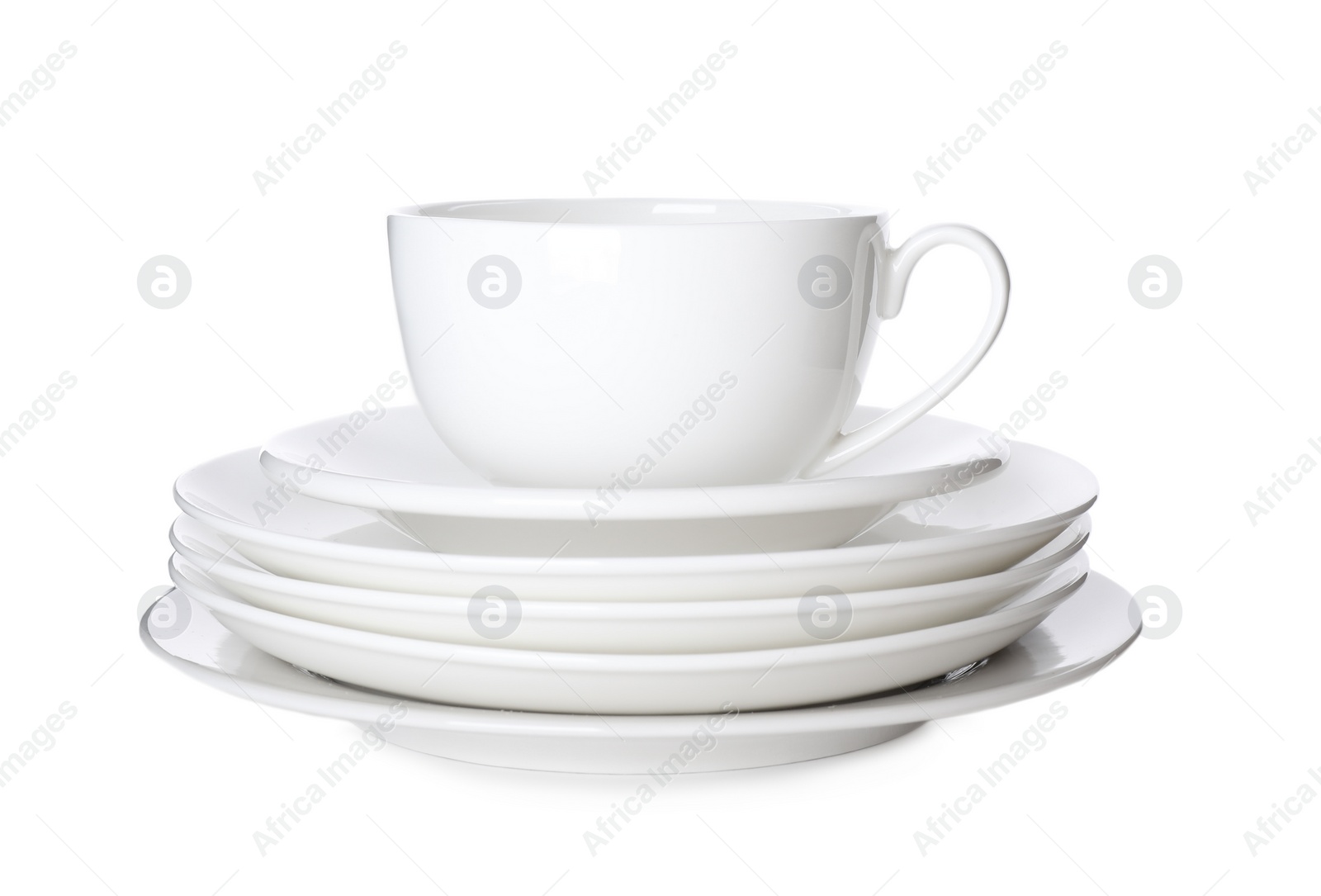 Photo of Stack of ceramic tableware isolated on white