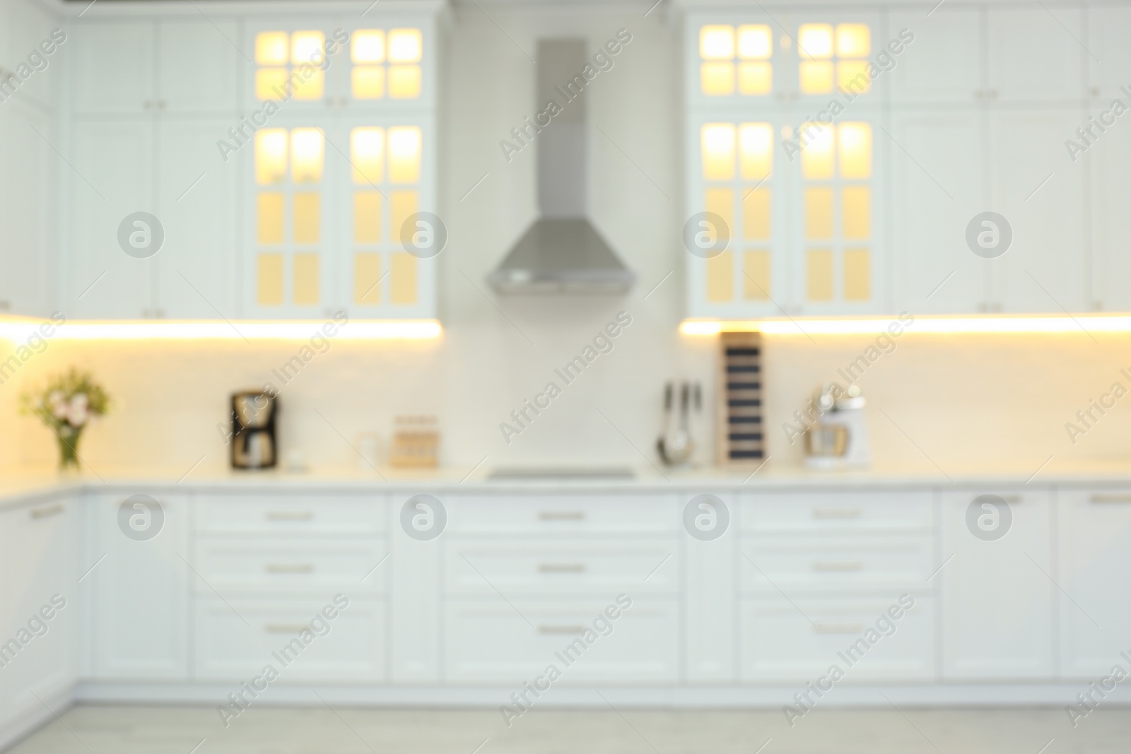 Photo of Blurred view of modern kitchen interior with stylish furniture