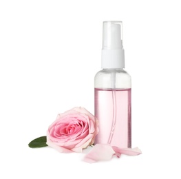 Bottle of essential oil and rose on white background