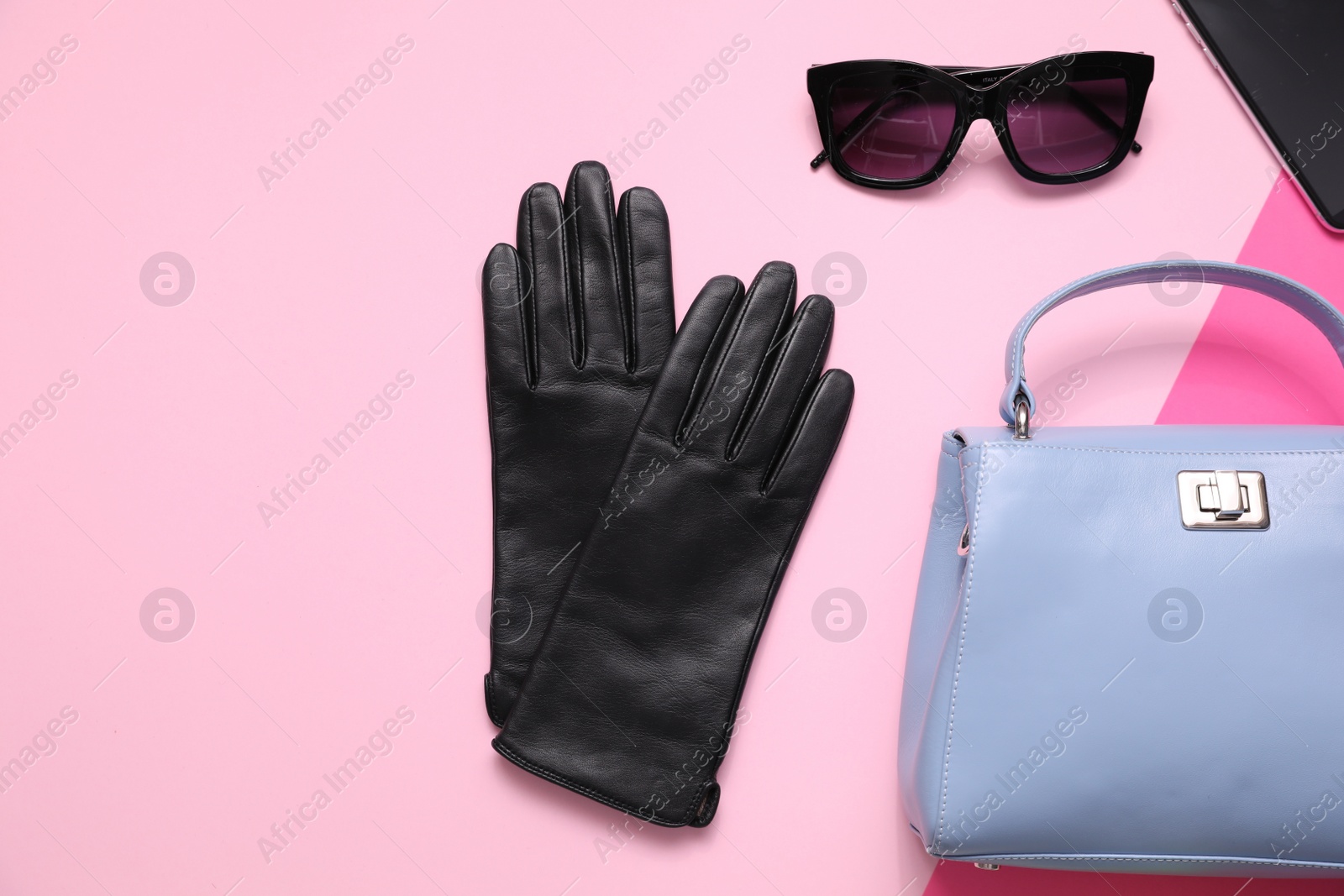 Photo of Flat lay composition with stylish black leather gloves and accessories on color background