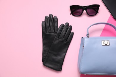 Photo of Flat lay composition with stylish black leather gloves and accessories on color background