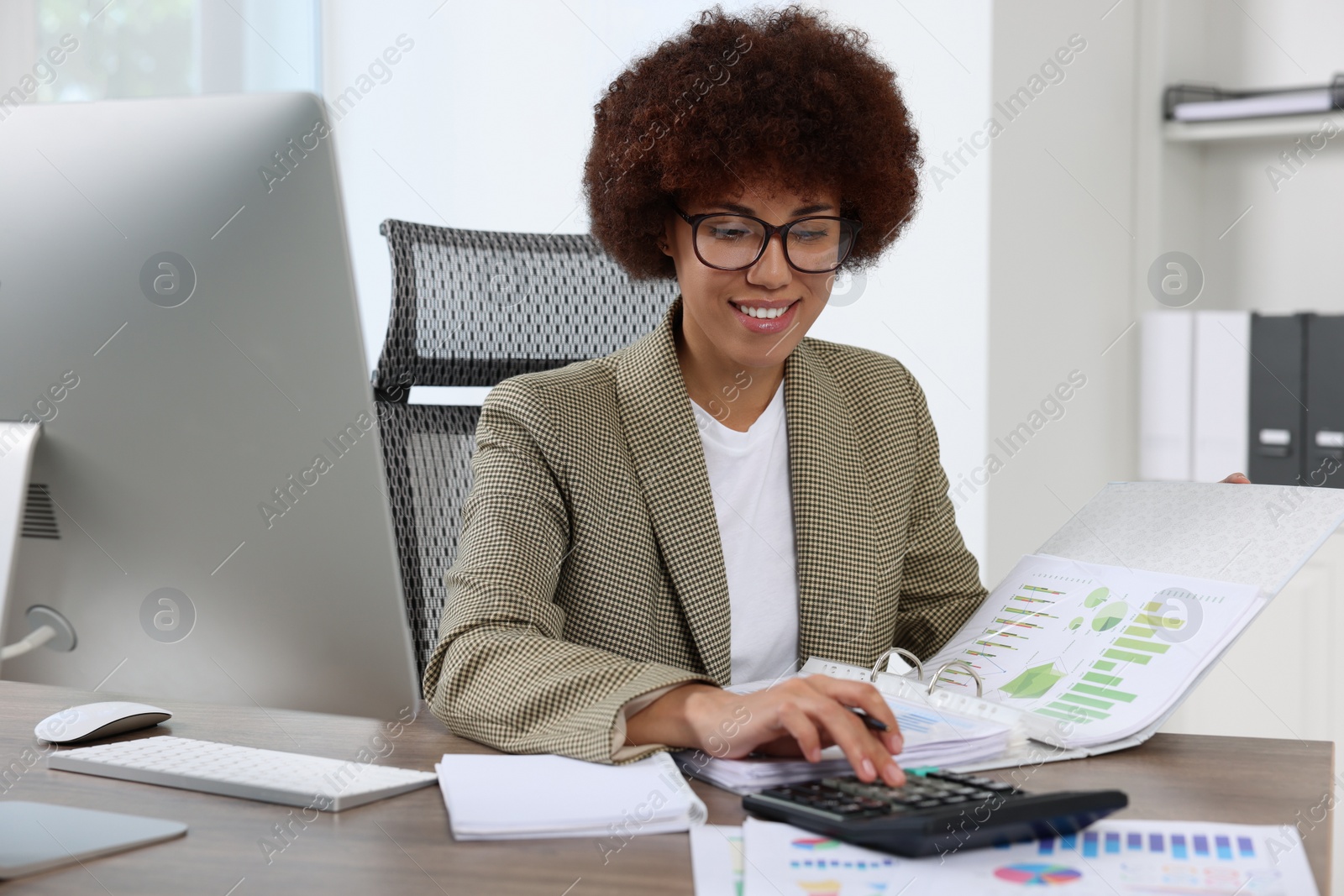 Photo of Professional accountant working at wooden desk in office