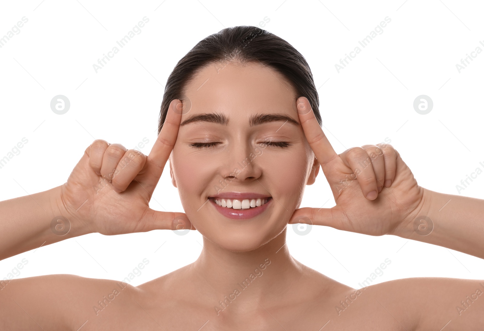 Photo of Young woman massaging her face on white background