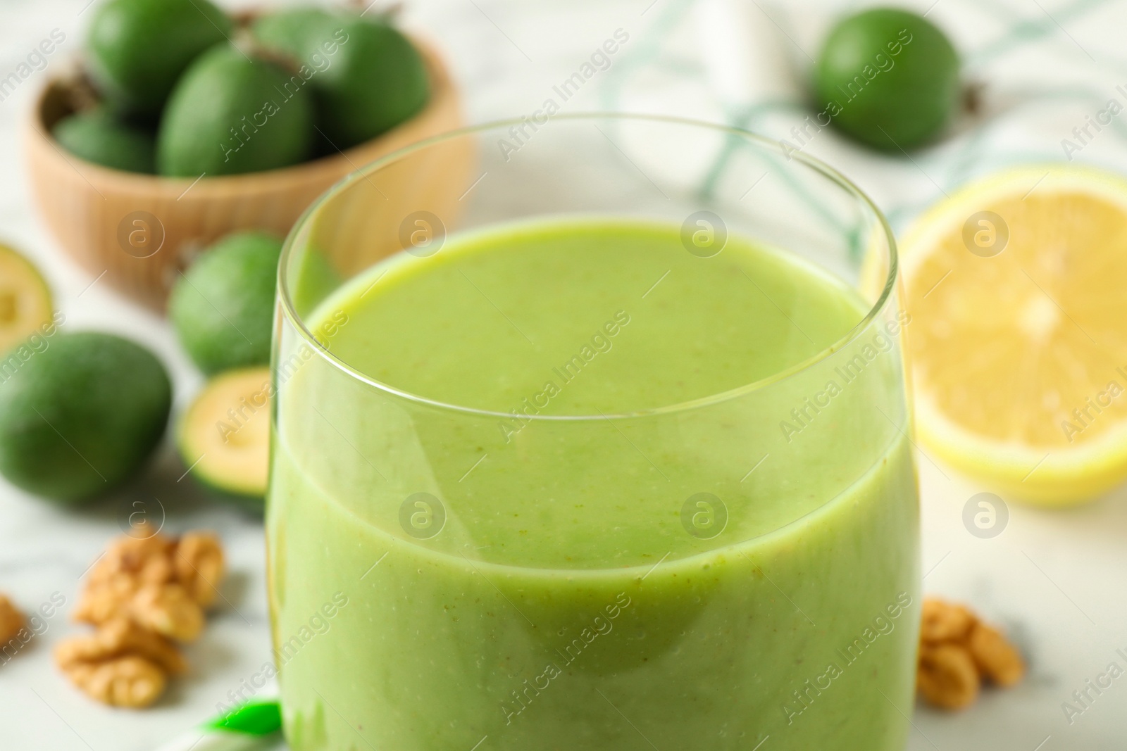 Photo of Fresh feijoa smoothie in glass, closeup view