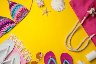 Photo of Flat lay composition with beach accessories on color background. Space for text