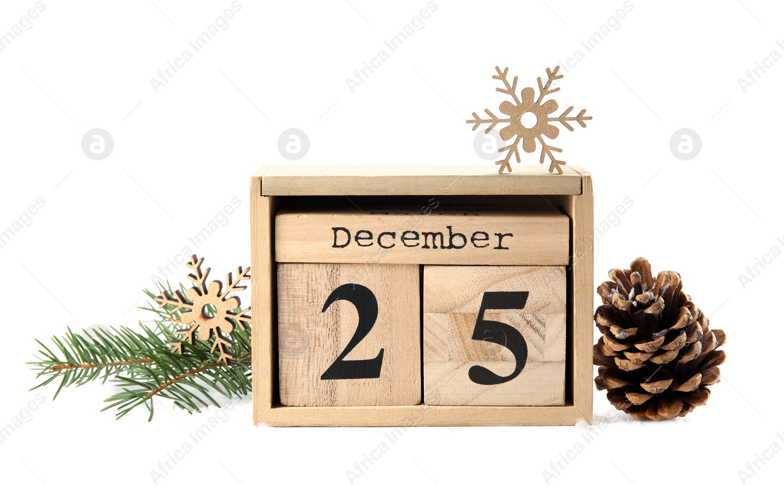 Photo of Wooden block calendar and festive decor on white background