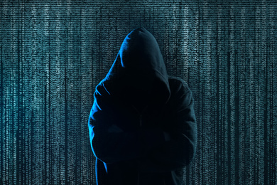 Image of Hacker and digital symbols on dark background. Cyber crime concept