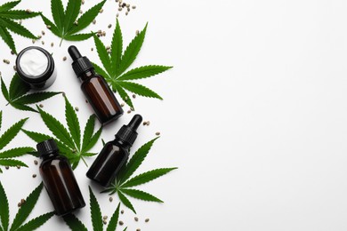 Flat lay composition with hemp leaves, CBD oil and THC tincture on white background, space for text