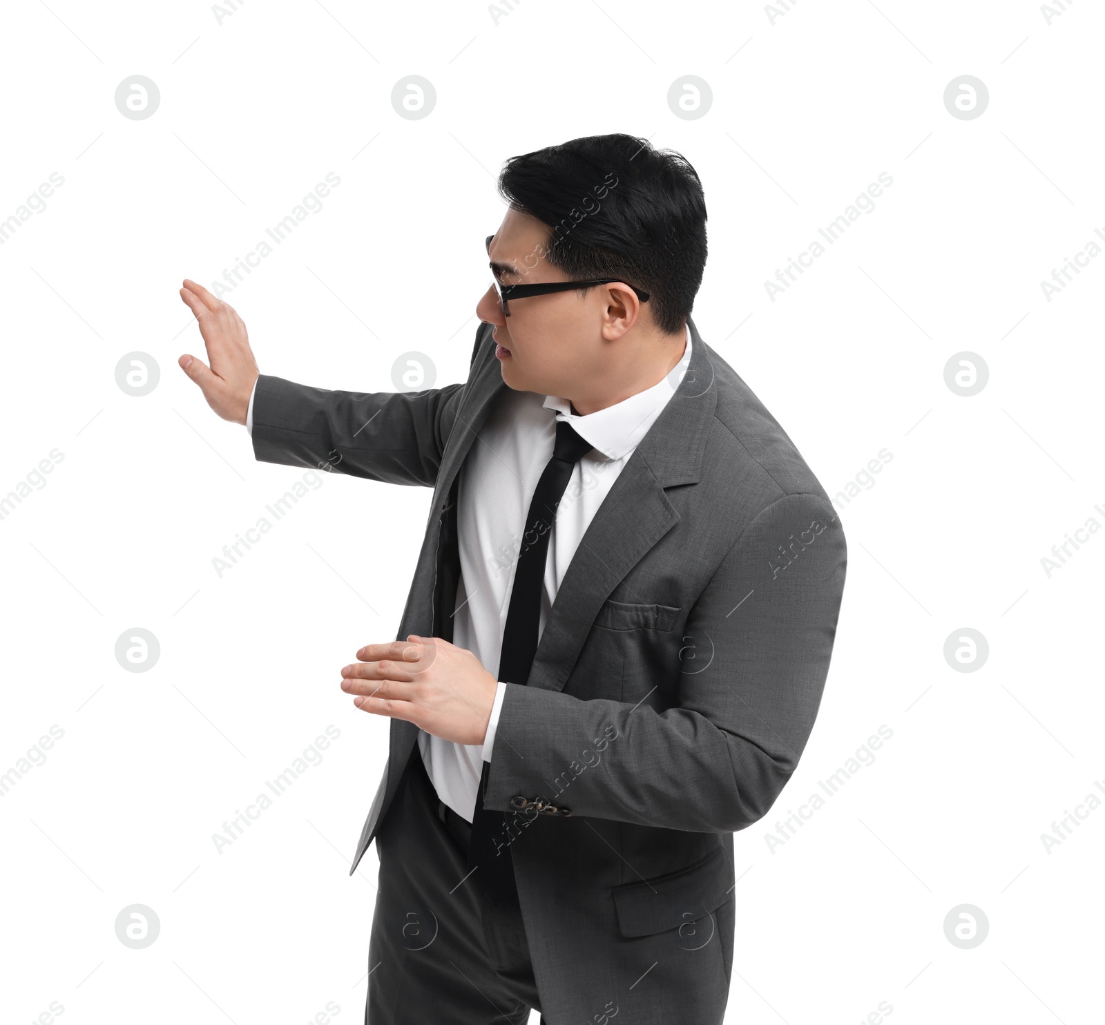 Photo of Scared businessman in suit posing on white background