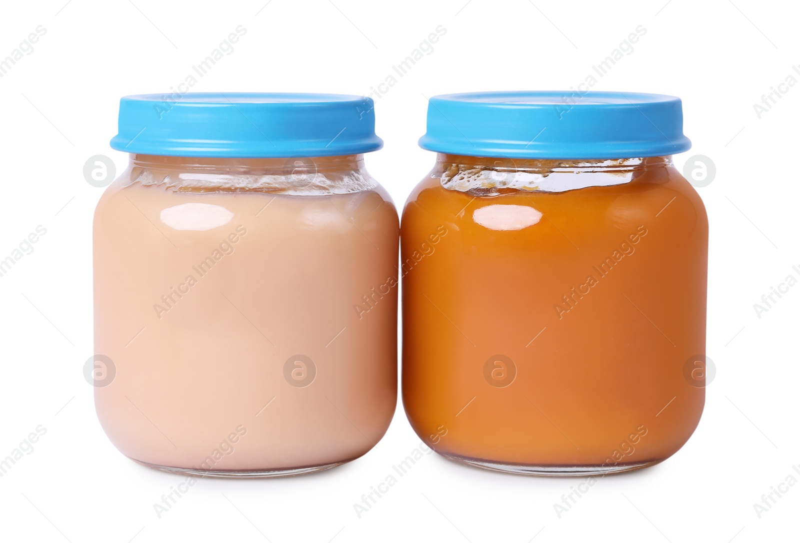 Photo of Glass jars with healthy baby food isolated on white