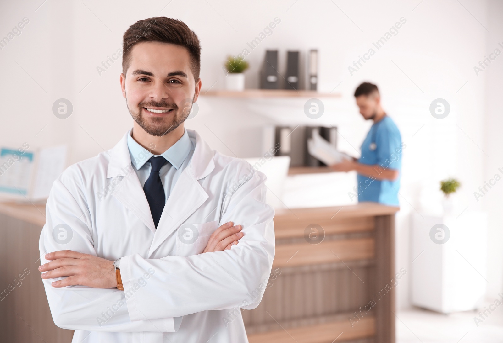 Photo of Portrait of male doctor in modern clinic