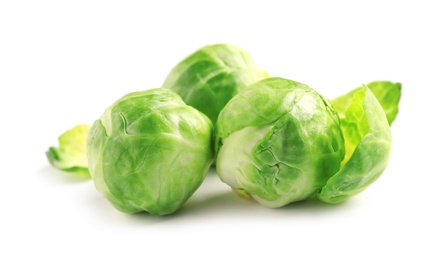 Fresh tasty Brussels sprouts on white background