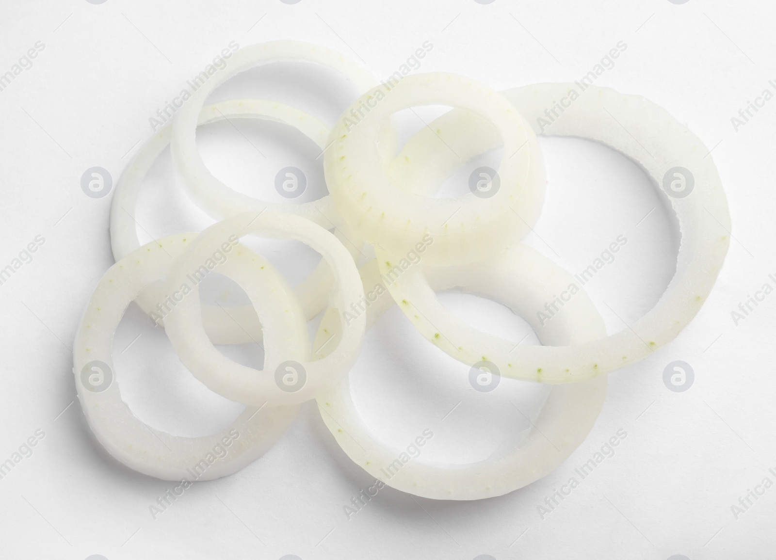 Photo of Fresh raw onion rings on white background