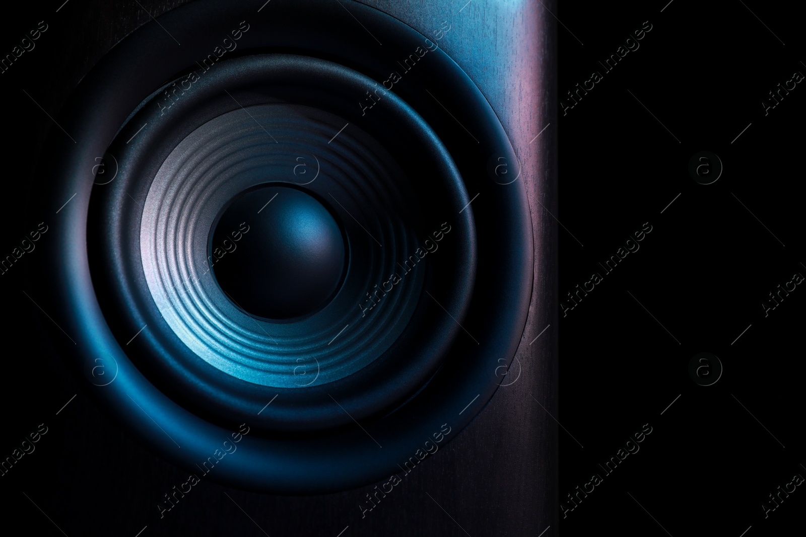 Photo of One sound speaker on black background, closeup