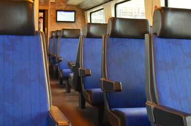 Photo of Interior of passenger train with empty seats
