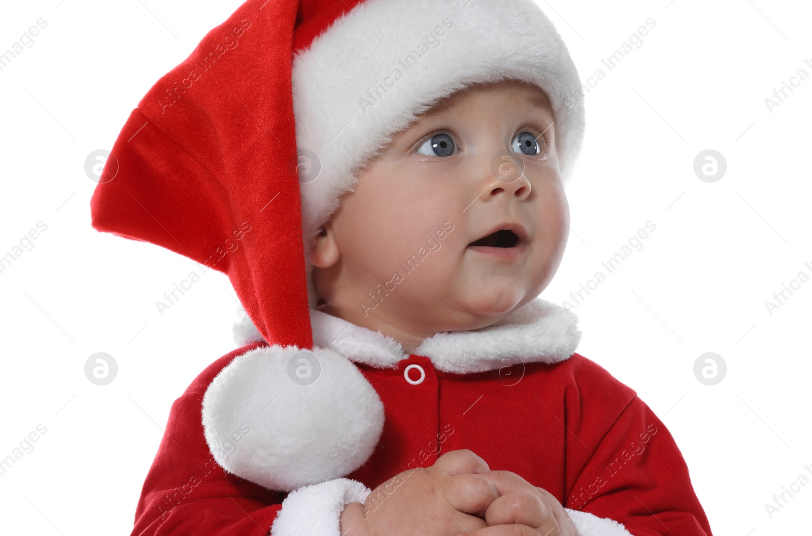 Photo of Cute baby in Christmas costume on white background, closeup