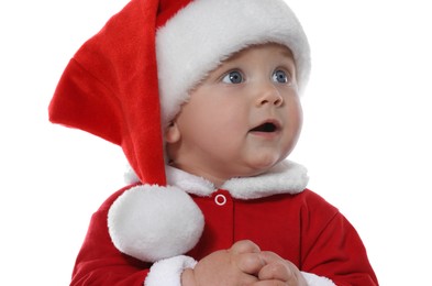 Photo of Cute baby in Christmas costume on white background, closeup