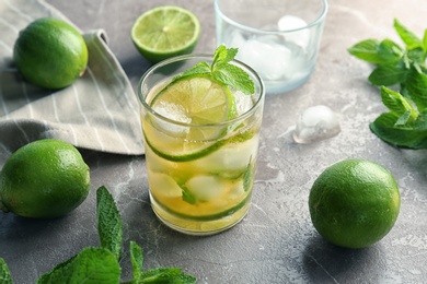 Photo of Composition with delicious mint julep cocktail on table