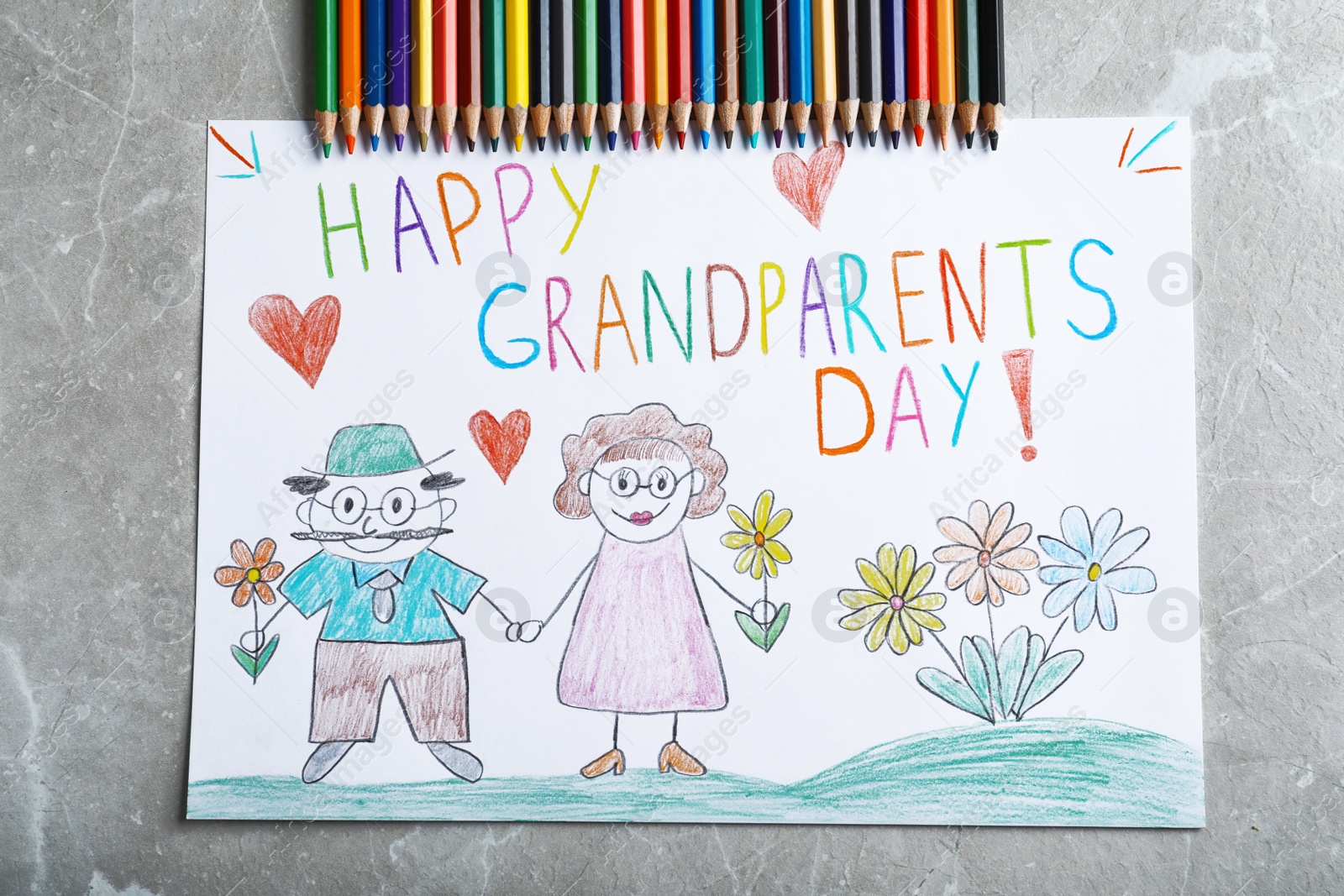 Photo of Beautiful drawing on grey table, flat lay. Happy Grandparents Day