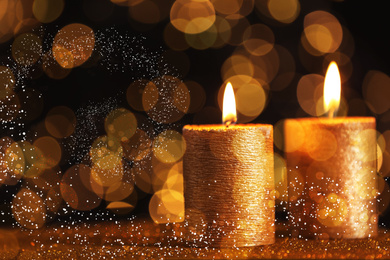 Image of Burning candles on dark background, bokeh effect