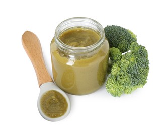 Tasty baby food in jar, spoon and fresh broccoli isolated on white