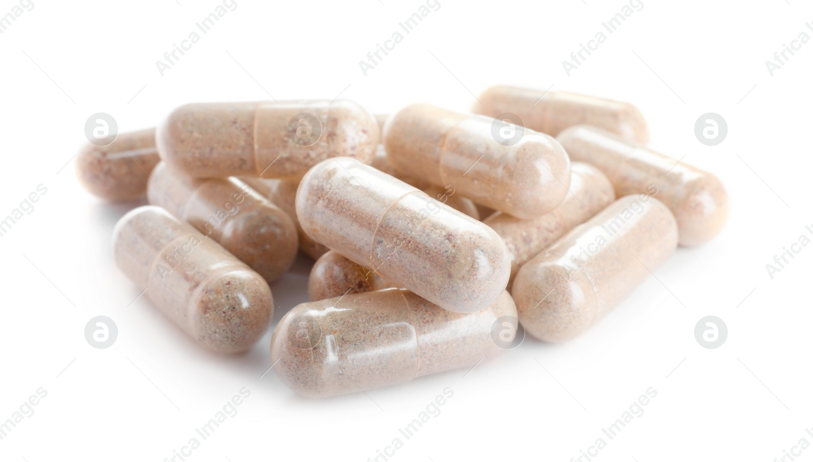 Photo of Many transparent gelatin capsules on white background