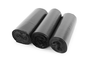 Photo of Rolls of black garbage bags isolated on white