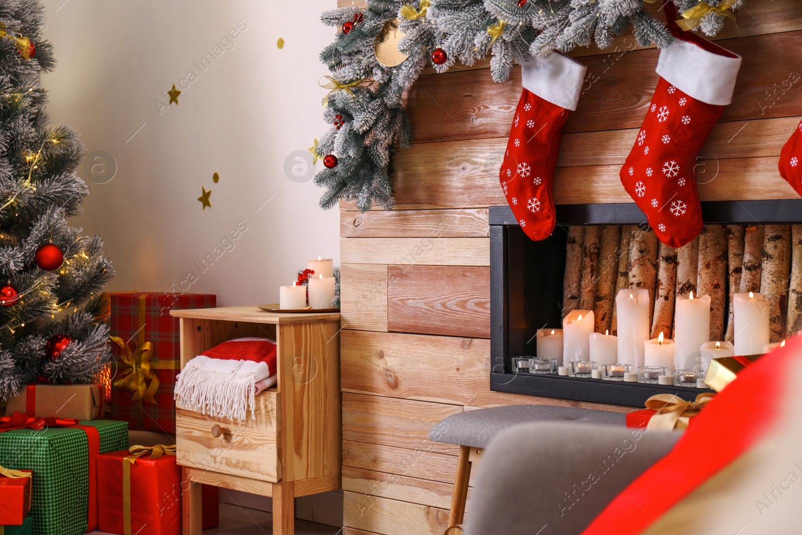 Photo of Stylish room interior with decorative fireplace. Christmas time