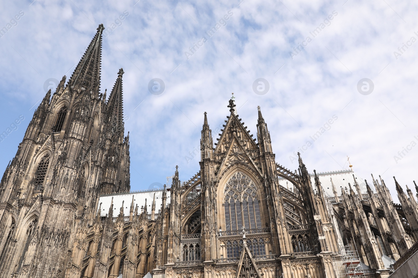 Photo of Cologne, Germany - August 28, 2022: Beautiful old gothic cathedral against blue sky