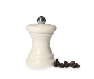 Photo of Pepper shaker isolated on white. Spice mill