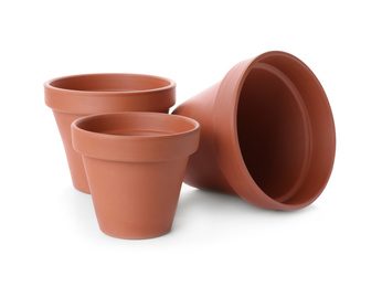 Photo of Stylish terracotta flower pots isolated on white