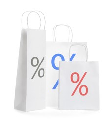 Paper bags with percent signs isolated on white