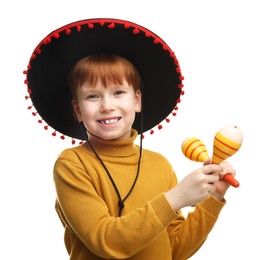 Cute boy in Mexican sombrero hat with maracas on white background
