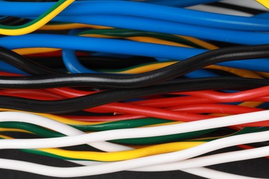 Photo of New colorful electrical wires as background, closeup