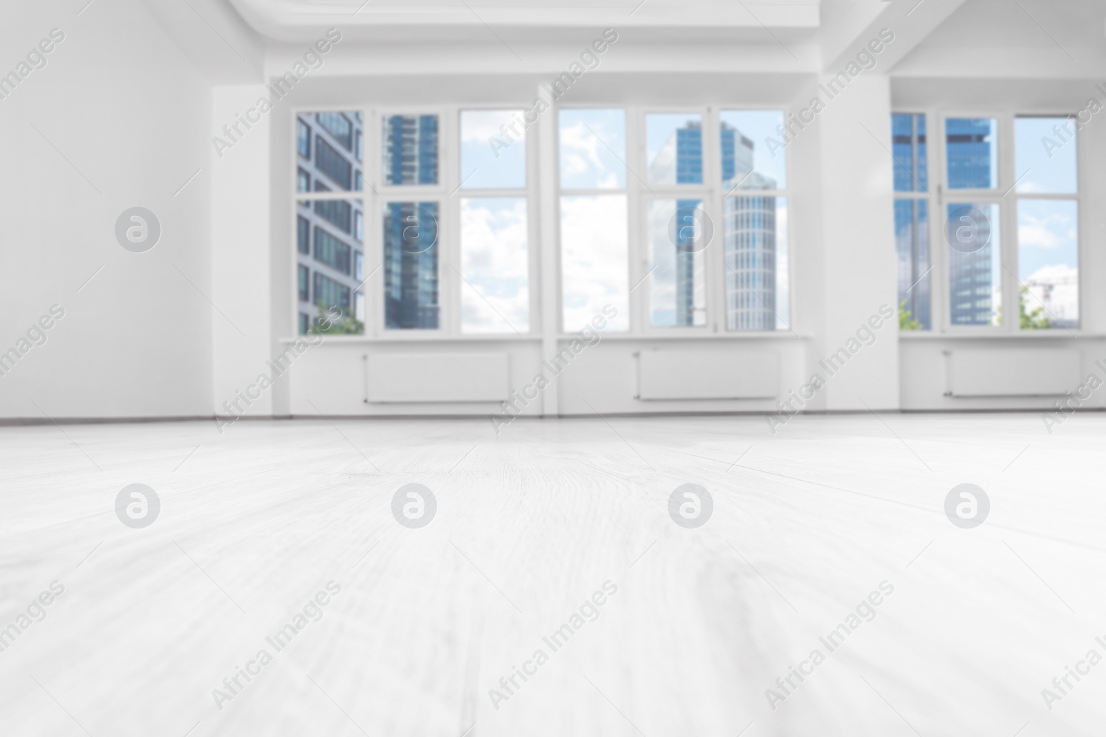 Photo of Modern office room with white walls and windows. Interior design