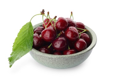 Tasty ripe sweet cherries in bowl isolated on white