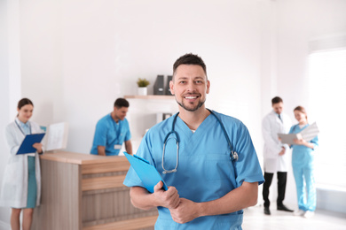 Portrait of male doctor in modern clinic