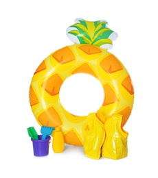 Photo of Inflatable ring, vest and beach toys isolated on white