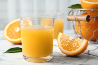 Photo of Composition with orange juice and fresh fruit on table