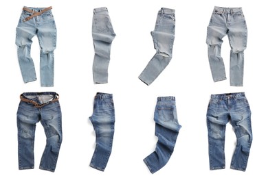 Set with different jeans on white background, top view