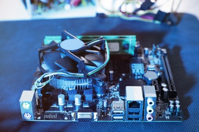 Photo of Motherboard on table, closeup. Computer repair service