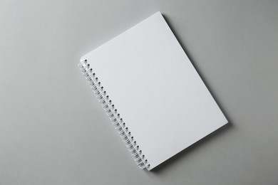 Photo of Blank notebook on grey background, top view. Mockup for design