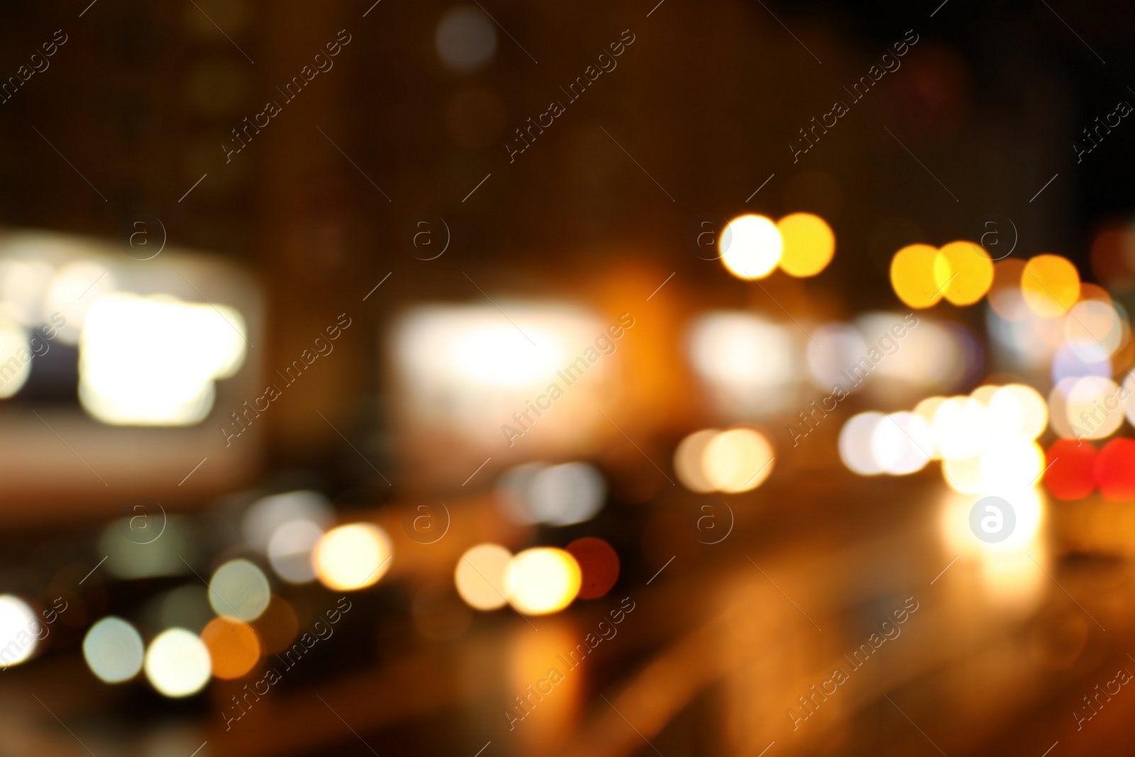 Photo of Blurred view of night city street with bokeh effect