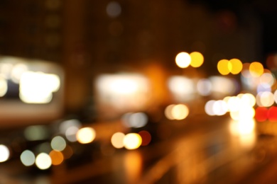 Photo of Blurred view of night city street with bokeh effect