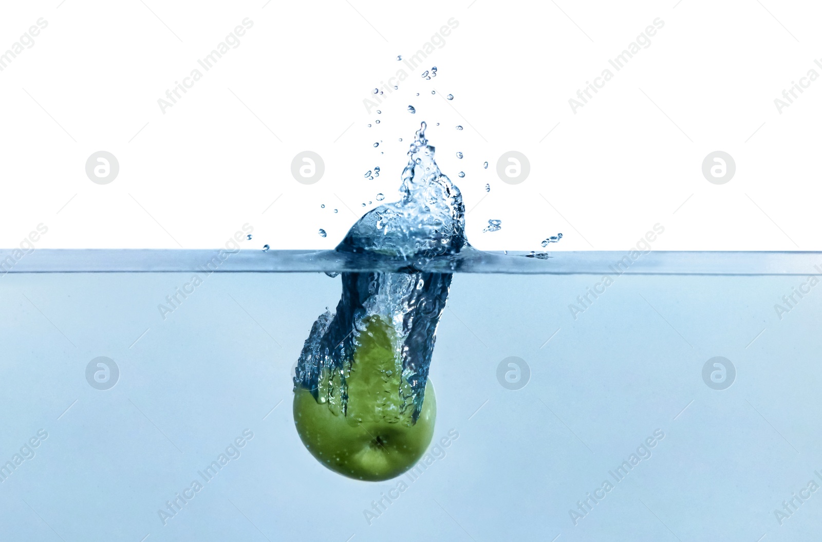 Photo of Apple falling down into clear water against white background