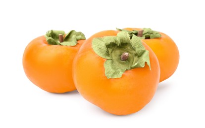 Photo of Whole delicious juicy persimmons on white background