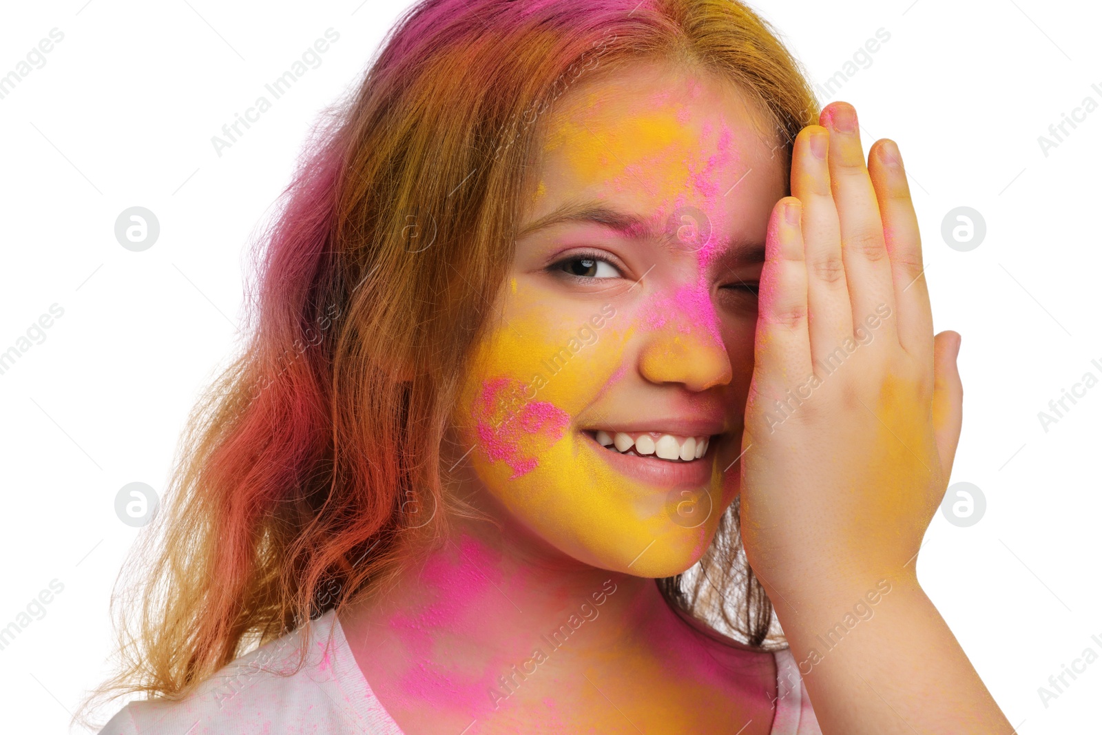 Photo of Teen girl covered with colorful powder dyes on white background. Holi festival celebration