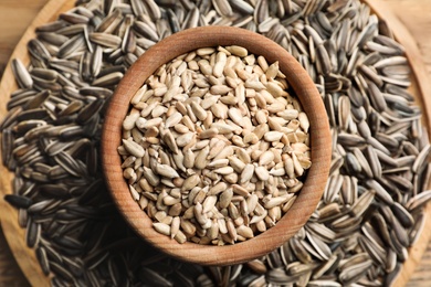 Photo of Raw sunflower seeds on table, top view