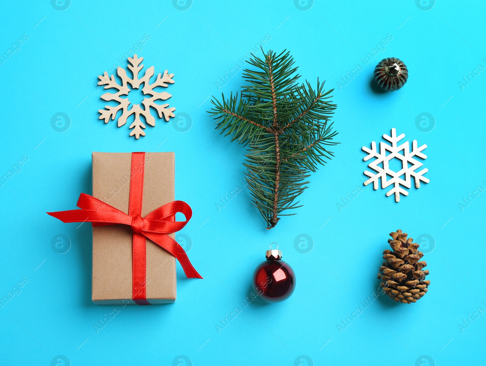 Photo of Flat lay composition with Christmas decor on light blue background