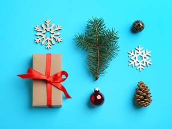 Flat lay composition with Christmas decor on light blue background